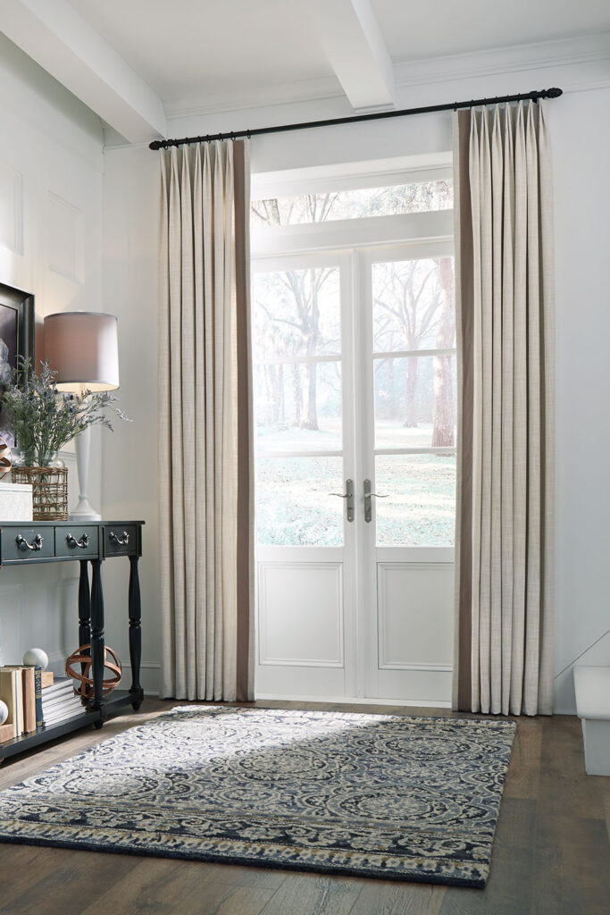 Olivia Pleat Drapery with vertical trim on French doors.