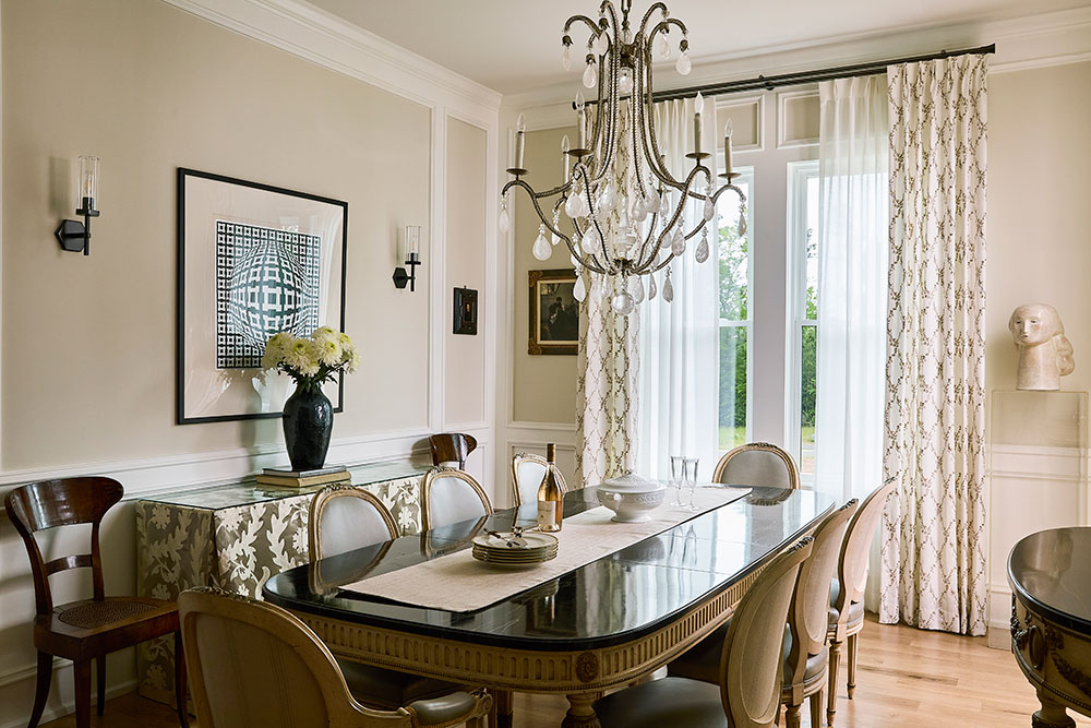 An elegant dining room with drapery and sheers on a double rod from Paris Texas Hardware.