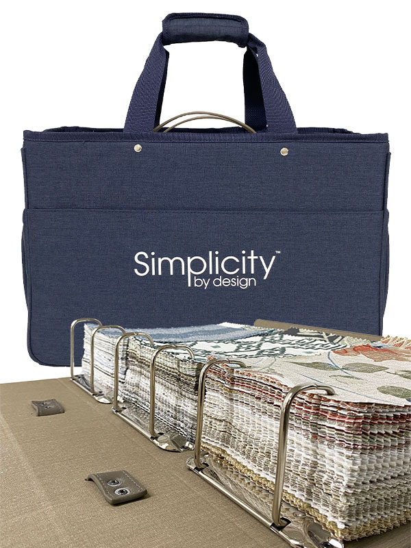 The Simplicity By Design 6th Generation sampling program from Carole fabrics, featuring a dark blue tote bag in the background and an open fabric sample binder in the foreground.